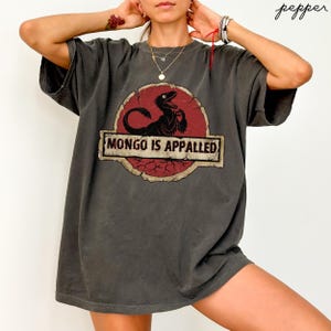 May include: A rustic wooden sign with the text "Welcome to our home" in white lettering. The sign features a distressed finish and a simple, inviting design, perfect for entryway decor.