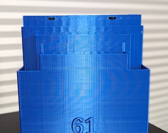 May include: A blue plastic storage box with the number 61 printed on the front.