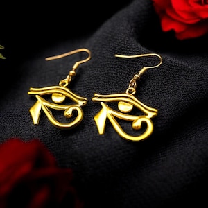 Handgefertigte afrikanische Goldauge von Horus Ohrringe - Symbol für Erbe, Schutz & Stil