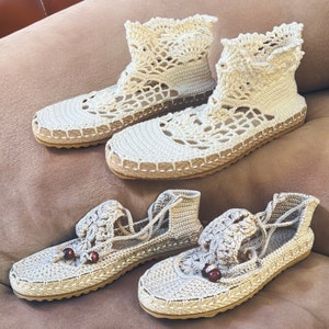 May include: Three pairs of crocheted sandals with a beige color. The sandals have a lace-like design and are made of a soft, comfortable material.