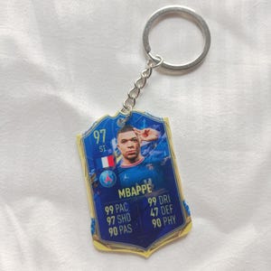 Portachiavi con figurina di Kylian Mbappé del PSG / Regalo di calcio francese per lui / Portachiavi in acrilico / Vincitore della Coppa del Mondo / Regalo con figurina EA Sports per i fan