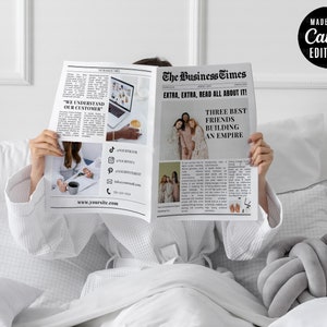 May include: A person holding open a newspaper titled "The Business Times" with the headline "EXTRA, EXTRA, READ ALL ABOUT IT!". The newspaper features articles and images, including the text "WE UNDERSTAND OUR CUSTOMER" and "THREE BEST FRIENDS BUILDING AN EMPIRE".