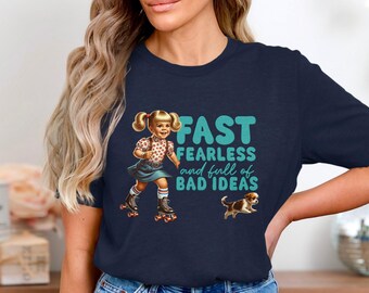 May include: A navy blue t-shirt with a graphic of a girl on roller skates and the text "FAST FEARLESS and full of BAD IDEAS".