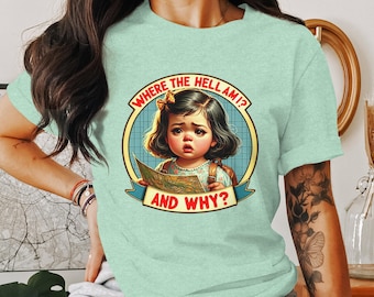 May include: A light green t-shirt with a cartoon illustration of a girl holding a map. The text on the shirt reads "Where the hell am I? And why?"