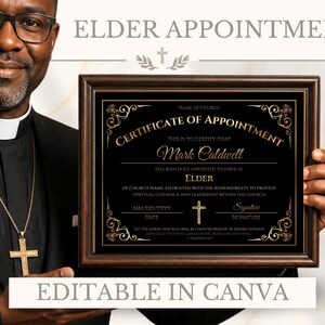 May include: A framed certificate of appointment for an elder, featuring black and gold text on a black background with ornate corner flourishes and a central cross icon. The document includes fields for name, date, and signature, presented in a dark wood frame.