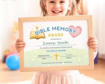 May include: A framed certificate titled BIBLE MEMORY AWARD with a gold open book, a yellow cross, and a pink heart. The text reads Presented to Emma Smith, For faithful memorization of God's Word, CHURCH NAME, Date, Pastor, and Thy word have I hid in mine heart - Psalm 119:11.