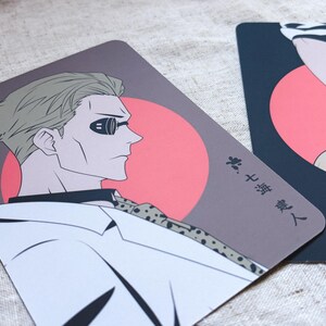 May include: Two illustrated cards featuring anime-style characters. One card shows a man in profile with sunglasses, a white shirt, and a patterned tie against a red circle. The other card has a hand and a figure with a red circle background.