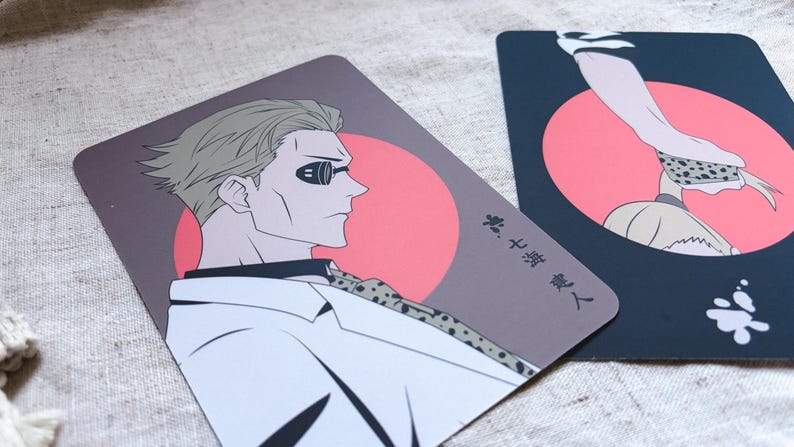 May include: Two illustrated cards featuring anime-style characters. One card shows a man in profile with sunglasses, a white shirt, and a patterned tie against a red circle. The other card has a hand and a figure with a red circle background.