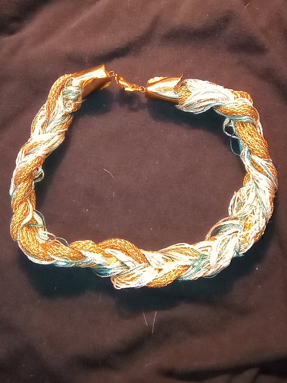 Metallic string and string braided choker