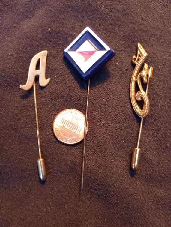3 stickpins- one lacks stop