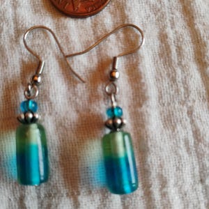 Blue cylinder dangle earrings