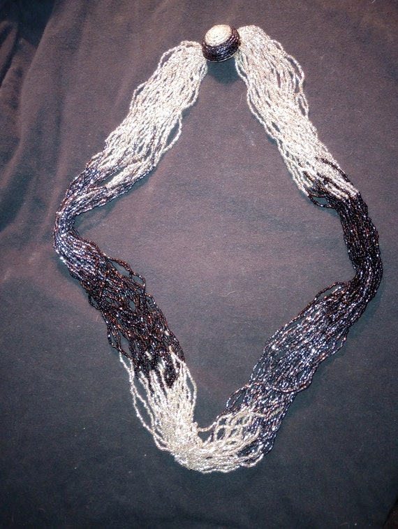 Multiple strands of small beads, silver and black… - image 2
