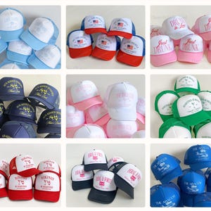 May include: A collection of trucker hats in various colors, including blue, red, pink, and white. Each hat features unique text and graphics, such as "Last Toast," "We the People," and "Just Drunk." The hats are designed with a mesh back.