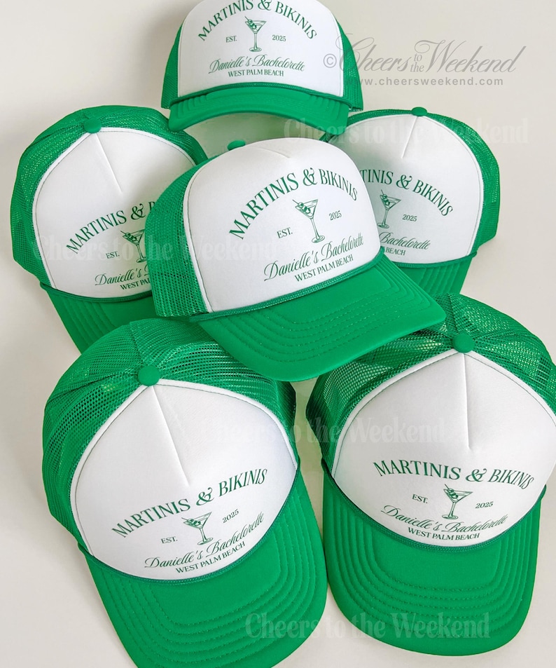 May include: A collection of green and white trucker hats. Each hat features the text "MARTINIS & BIKINIS" and "Danielle's Bachelorette WEST PALM BEACH" in green. The hats have a mesh back and a curved brim.