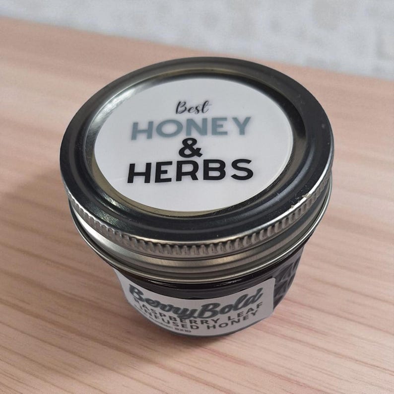 Glass honey jar with herbal infusion, shown from top-front angle