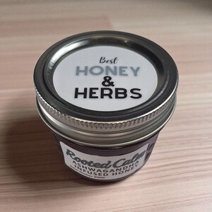 Top and front view of 4 oz herbal honey jar on wood surface