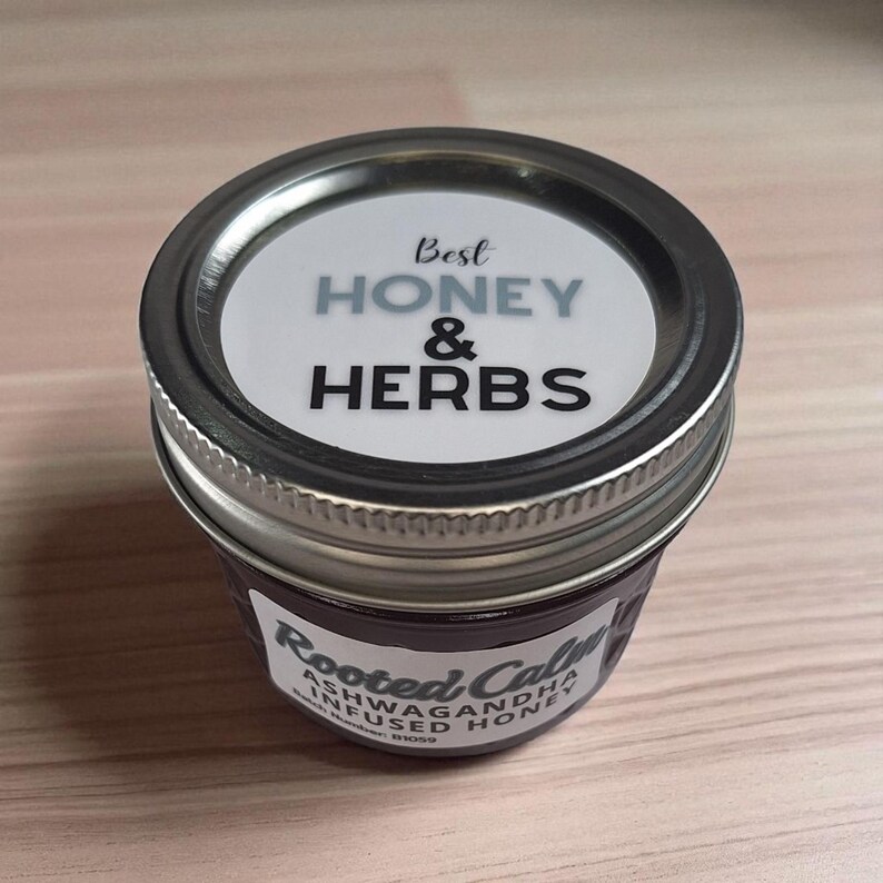 Top and front view of 4 oz herbal honey jar on wood surface