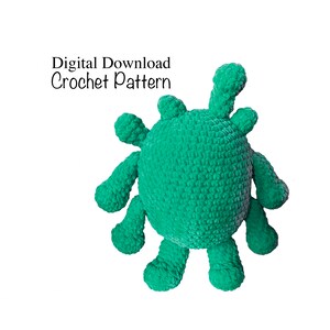 May include: A handmade, green crochet monster toy with multiple appendages. The plush creature has a round body and several protruding arms and legs. The text "Digital Download Crochet Pattern" is displayed in the upper left corner.
