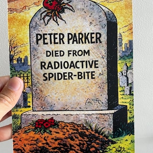 May include: A humorous illustration depicts a tombstone with the inscription "PETER PARKER DIED FROM RADIOACTIVE SPIDER-BITE." A red and black spider sits atop the stone. The background shows a sunset and a city skyline.