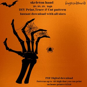 May include: Black skeleton hand stencil with a spider web and spider on an orange background. Text reads "skeleton hand" and "DIY Print, Trace & Cut pattern". The stencil is available in 2ft, 3ft, and 4ft sizes.