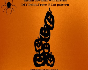 May include: A black pumpkin tower silhouette with carved faces, on an orange backdrop. Text includes "pumpkin tower" and "DIY Print, Trace & Cut pattern". The design is available up to 183 cm high.