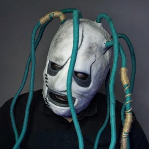 A replica of Corey Taylor’s mask. Slipknot era album IOWA 2001. Corey Taylor mask with green dreadlocks.
