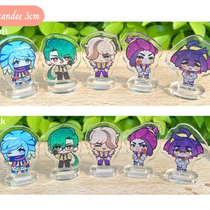 May include: Mini standees of 8 different characters, each with a unique design and color scheme. The standees are 3 cm tall and are displayed on clear acrylic bases. The characters are all in a cartoon style and have a variety of expressions. The standees are perfect for adding a touch of whimsy to any desk or shelf.