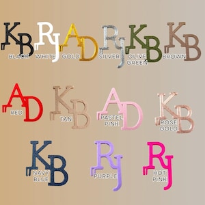 May include: A collection of colorful letter and initial designs in various colors, including black, white, gold, silver, olive green, brown, red, tan, pastel pink, rose gold, navy blue, purple, and hot pink. Each design features a unique font.