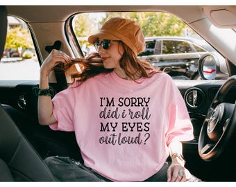 May include: A pink t-shirt with the text "I'm sorry did I roll my eyes out loud?" printed on the front.