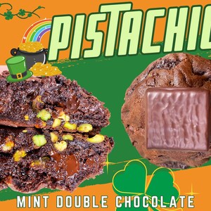 May include: Close-up of two chocolate chip cookies with pistachios and a chocolate square on top. The cookies are on a green and orange background with the text "PISTACHIO MINT DOUBLE CHOCOLATE" at the bottom.