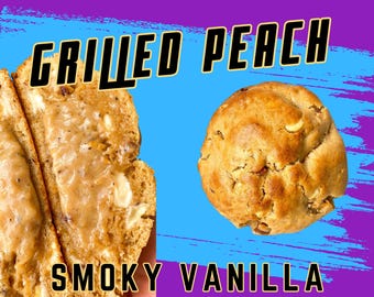 May include: A close-up of a grilled peach cookie with a smoky vanilla filling. The cookie is light brown and has a slightly crispy texture. The filling is a creamy, light brown color and has a smoky flavor.