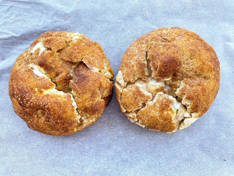 Snickerdoodles cookie, giant vanilla cinnamon cookie with white chocolate chips, and rolled in sugar and cinnamon for crispy crust.