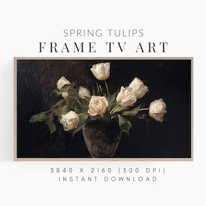 May include: A framed digital art print featuring a still life of white tulips in a dark vase against a dark background. The text "SPRING TULIPS FRAME TV ART" is displayed at the top. The resolution is 3840 x 2160 (300 DPI) and is an instant download.
