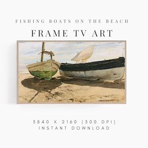 May include: A digital painting of two fishing boats on a sandy beach. The boats are white with black accents and are partially submerged in the sand. The sky is a light blue with white clouds. The painting is framed in a light wood frame.