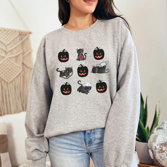 Cute Halloween Nurse Sweater with Black Cats and Jack O Lanterns, Fun Gift for Pediatric, NICU, Maternal Nurses