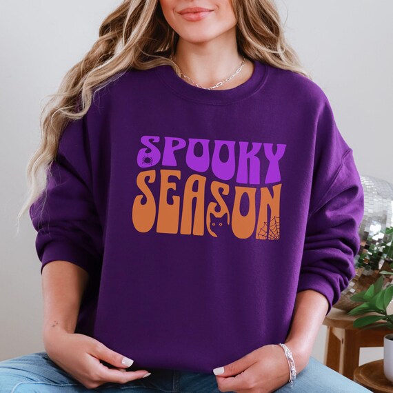 Halloween Purple Sweatshirt, “Spooky Season” in Purple Orange Wavy Text with Spider and Cat, Crewneck Pullover, Fall Fashion, Cozy Top