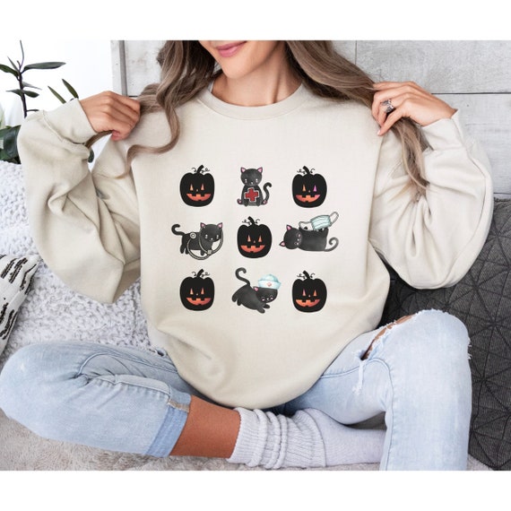 Cute Halloween Nurse Sweater with Black Cats and Jack O Lanterns, Fun Gift for Pediatric, NICU, Maternal Nurses