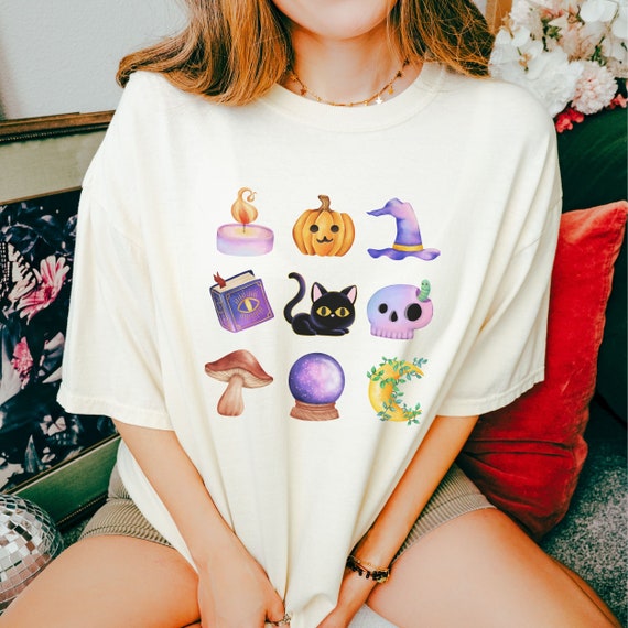 Cute Halloween Black Kitty Cat Graphic-T with Watercolor Mushroom, Witches Hat, Book of Spells and Candle on an oversized shirt
