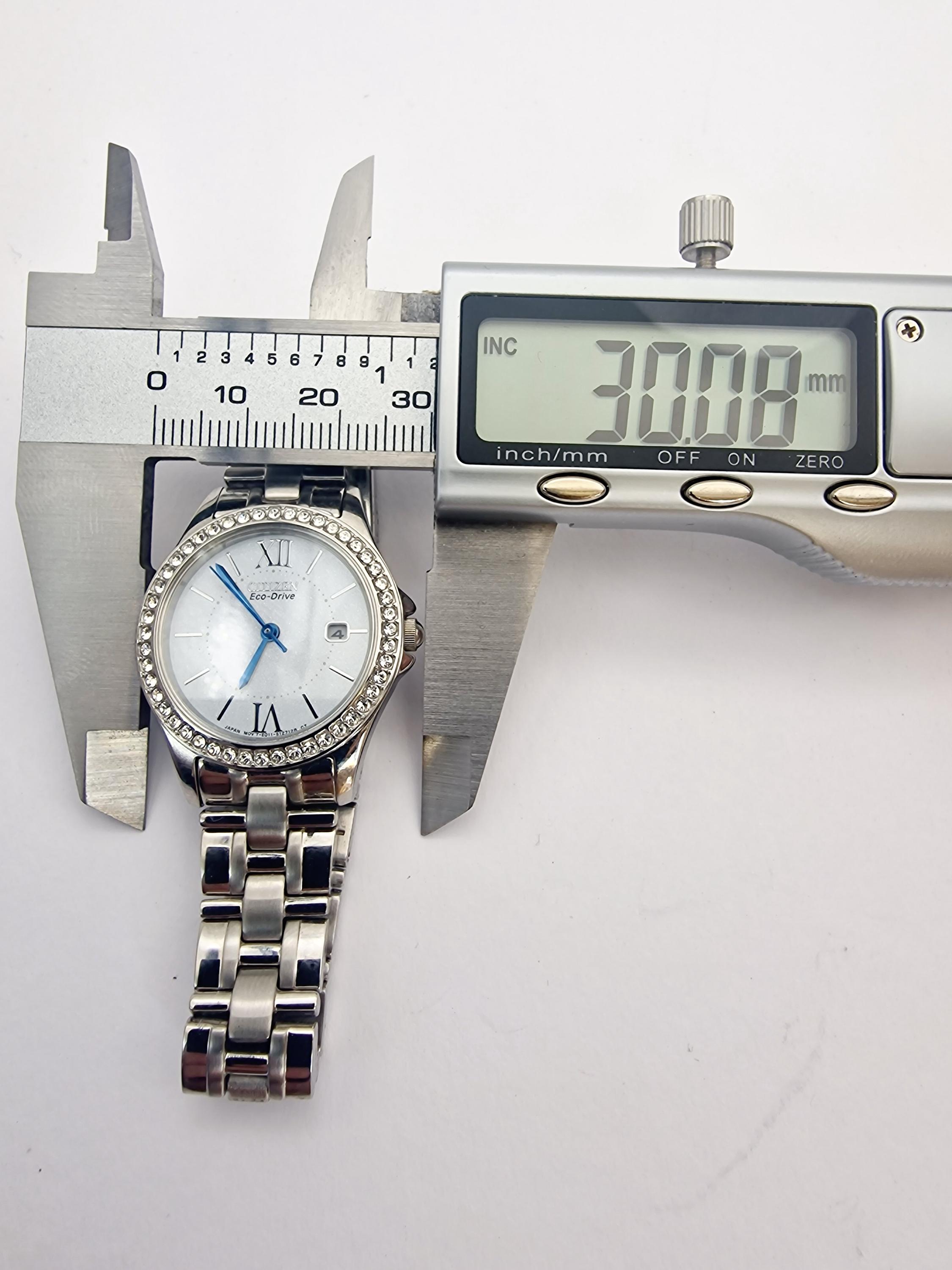 CITIZEN ECO-DRIVE With Date and Crystal Set Bezel Womans Watch (E2
