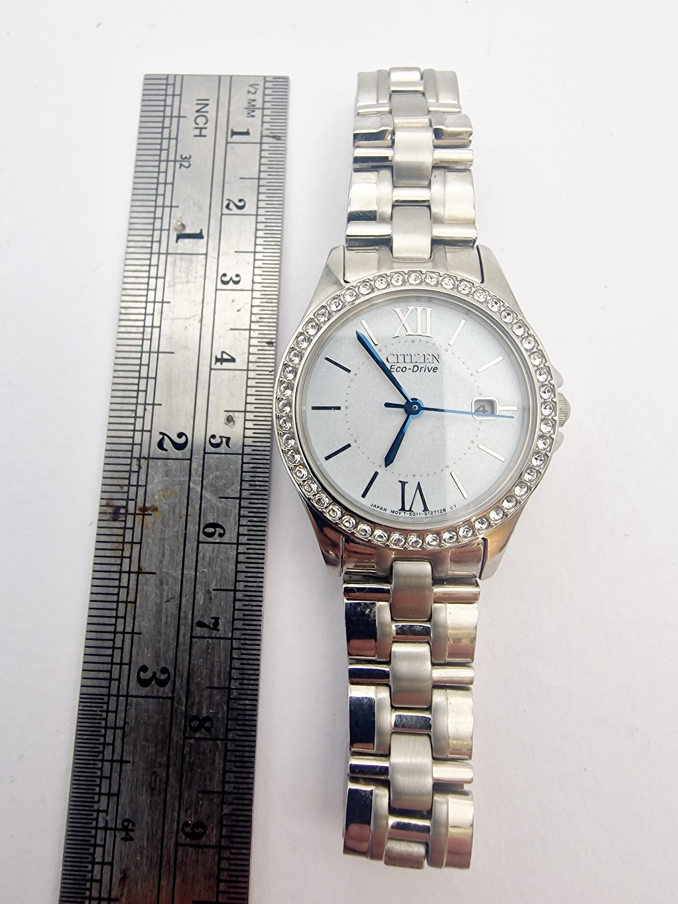 CITIZEN ECO-DRIVE With Date and Crystal Set Bezel Womans Watch (E2