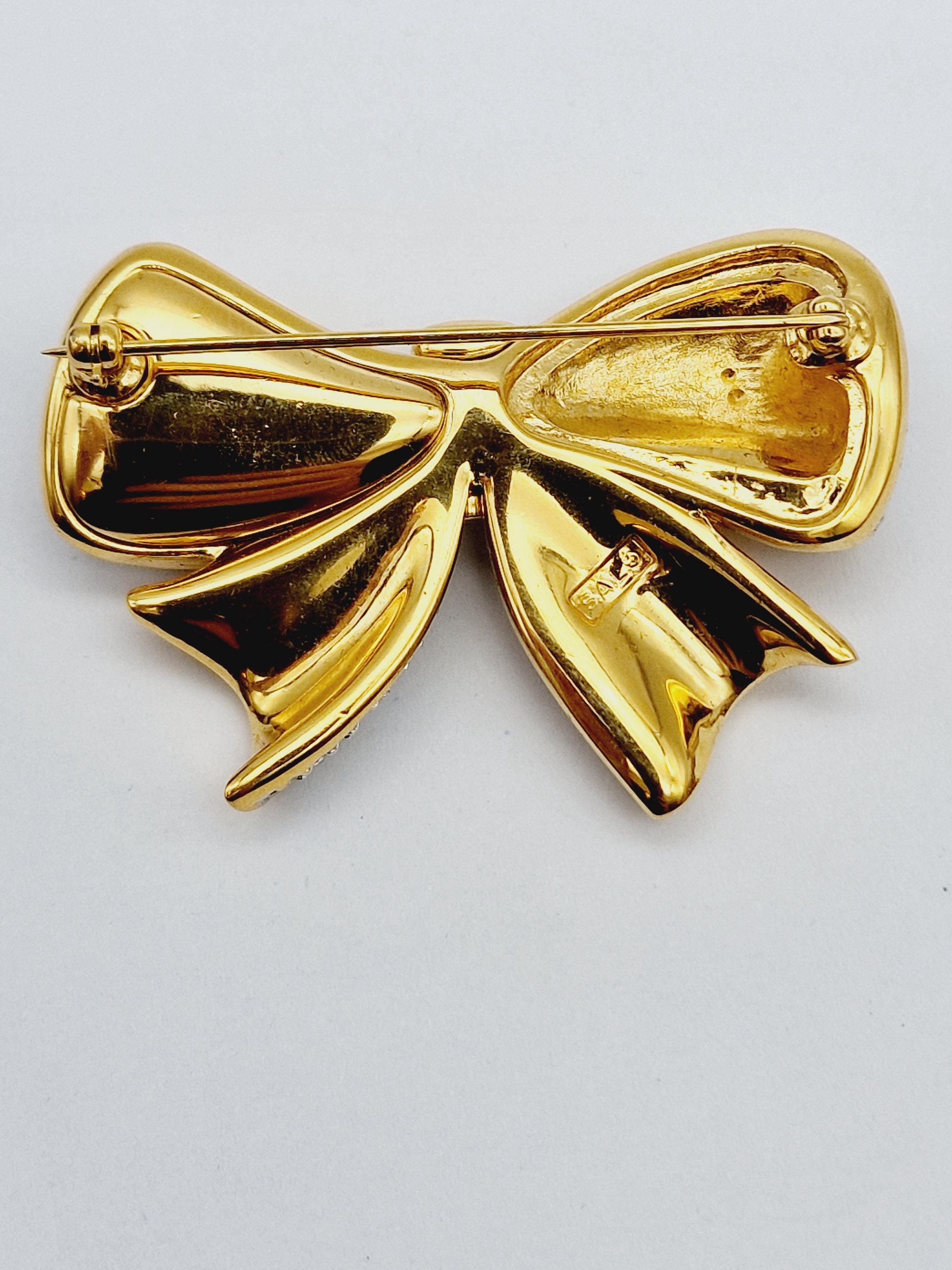 Spilla vintage a fiocco in oro massiccio 18 Kt | Historian Lugano