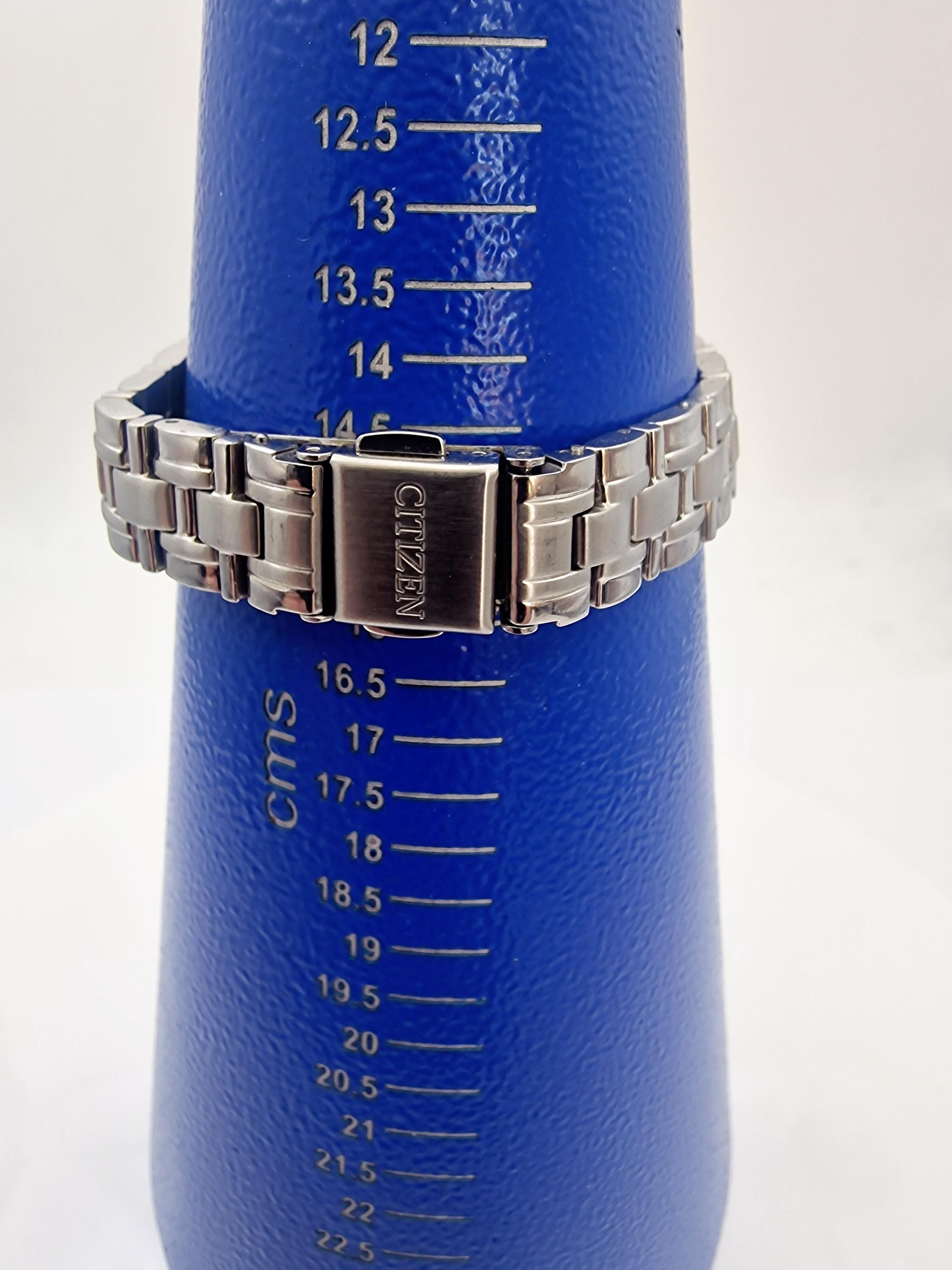 CITIZEN ECO-DRIVE With Date and Crystal Set Bezel Womans Watch (E2