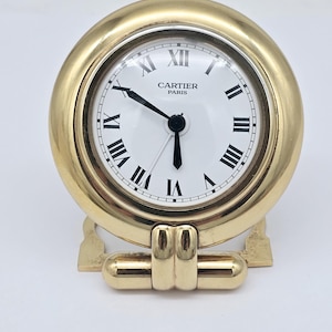 Reloj despertador de viaje vintage de cuarzo Cartier Colisee Art Deco chapado en oro, década de 1990