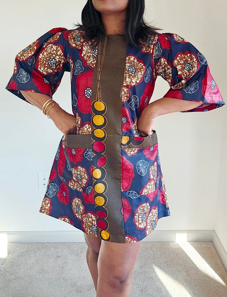 black free flowing african print dress with pockets . one size main image 1