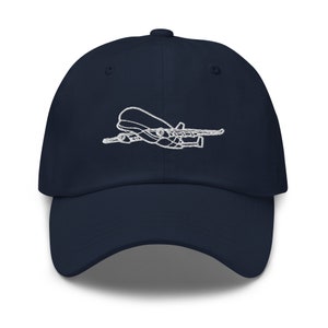 May include: A navy blue baseball cap with a white embroidered outline of an aeroplane.