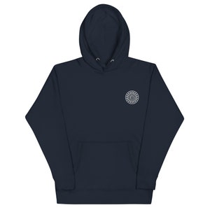 May include: A dark blue hooded sweatshirt with a white embroidered design of a stylized fan on the left chest.