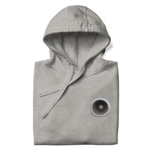 May include: A gray hooded sweatshirt with a jet engine graphic on the front.