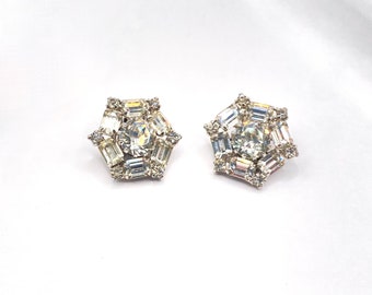 Weiss earrings with clear rhinestones in round and emerald cut arranged in an hexagon shape. Vintage American quality. 1" diameter..