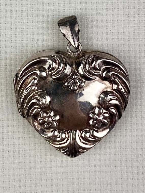 Sterling silver repoussé puffy heart locket to hol