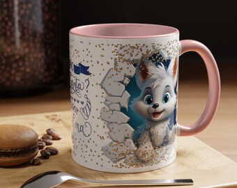May include: White ceramic mug with a pink interior and handle. The mug features a cartoon fox design breaking through a wall, with gold glitter accents. Text in blue script is visible on the side. A spoon, macaron, and coffee beans are on a wooden surface.